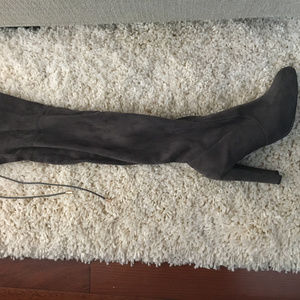 Knee high grey high-heeled boots